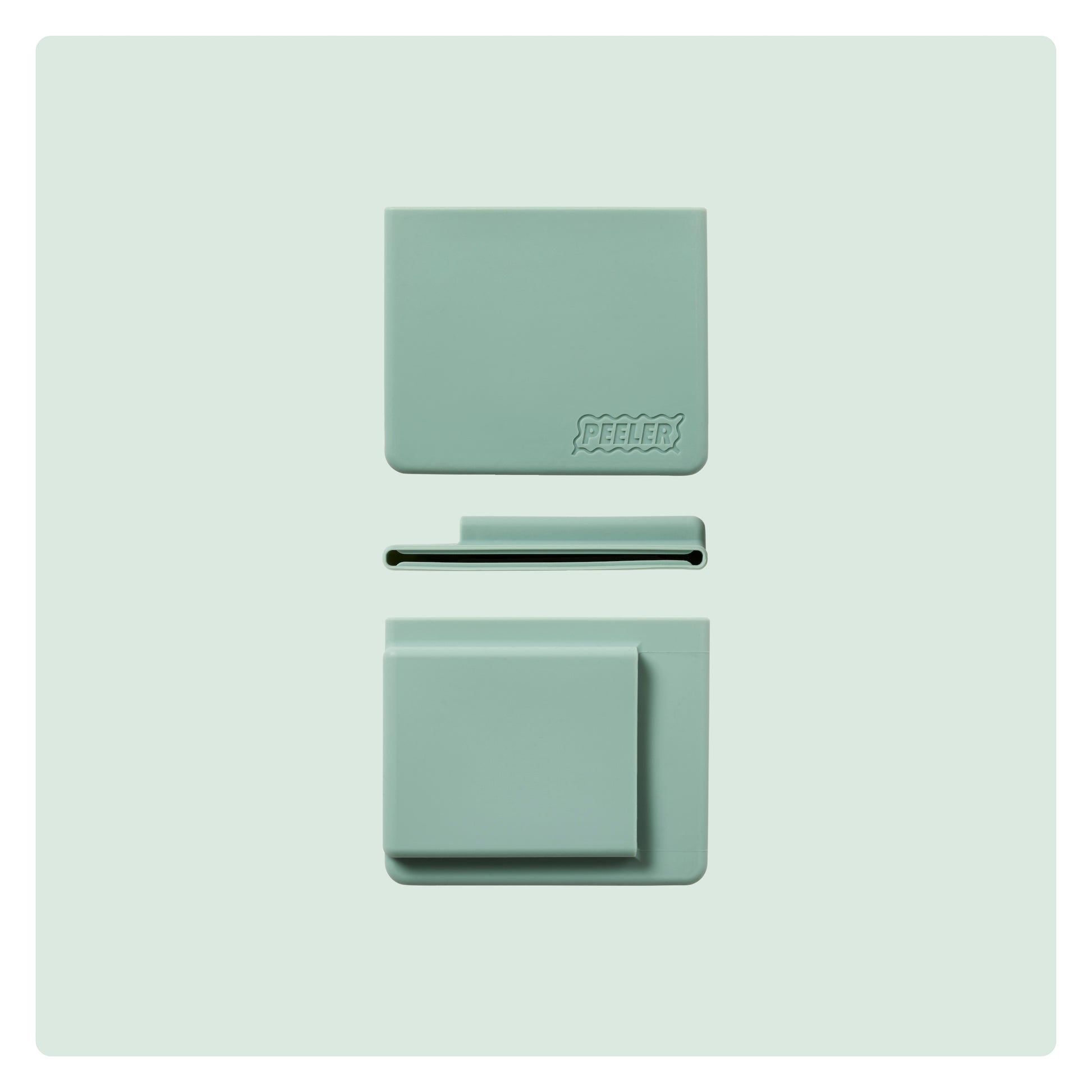 A sage-green silicone slim wallet laid flat, showing the front, side and back with the 'Peeler' logo embossed in the corner.